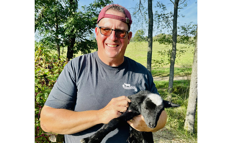 Charles with baby goat