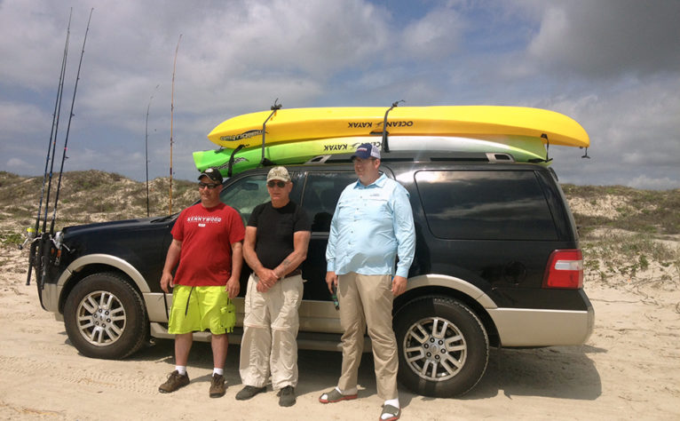 Charles with family and kayaks