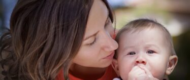 young woman holding baby